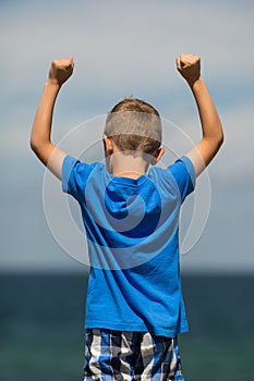 Boy with clenched fists