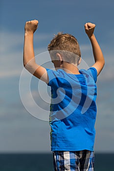 Boy with clenched fists