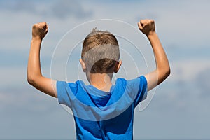 Boy with clenched fists