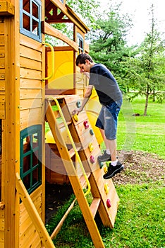 Boy Climbing Rock Wall Playhouse