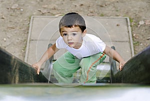 Boy climbing slide
