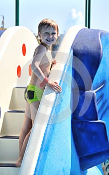 Boy climbing water slide