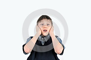 The boy closed his ears with his hands