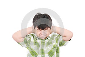 Boy closing his eyes and ears with his hands