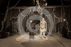 Boy Clown on Stage with Girl Holding Balloons