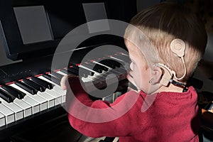 A Boy With Cochlear Implants Playing