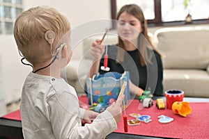 A Boy With Cochlear Implants Playing photo