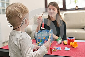 A Boy With Cochlear Implants Playing