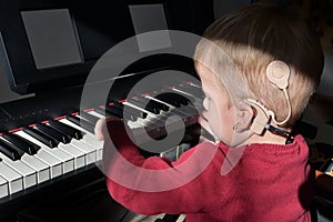 A Boy With Cochlear Implants Playing photo