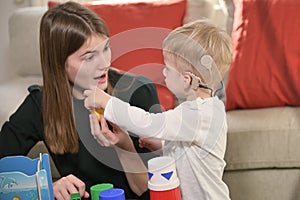 A Boy With Cochlear Implants Playing photo
