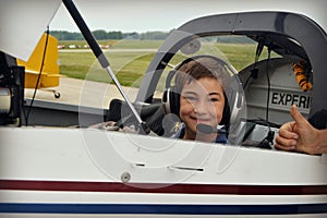 Boy in Cockpit of Airplane