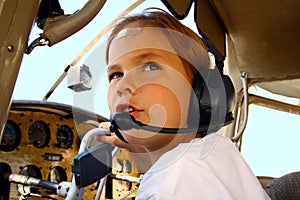 Boy in cockpit of private airplane