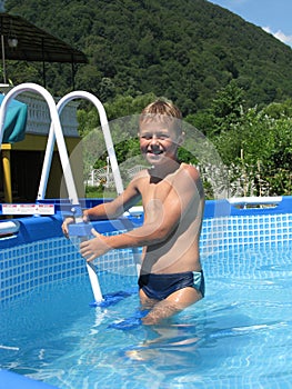Boy in collapsible pool photo