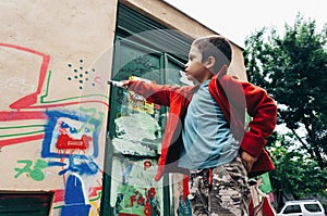 Boy with colorful graffiti