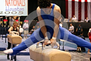 Boy competing on pommel photo