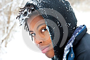 Boy covered with a little snow