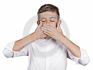 Boy, covering his mouth with hands won't talk. Speak no evil