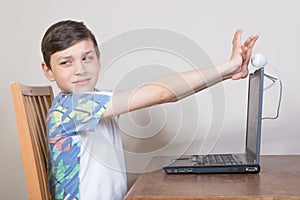 Boy covering his webcam