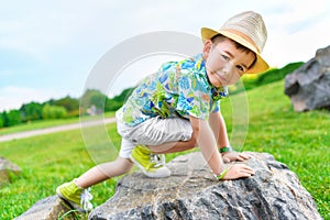 Boy cragsman of five years, training to ascend