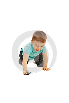 Boy crawling and play with small toy car