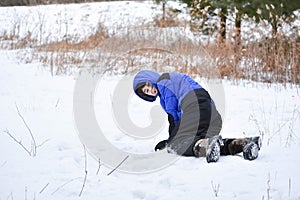 Boy Crawling Through the Snow Playing photo