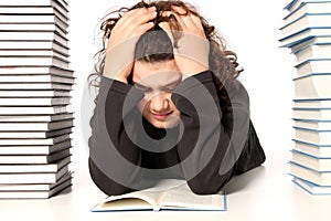 Boy crying and and many books