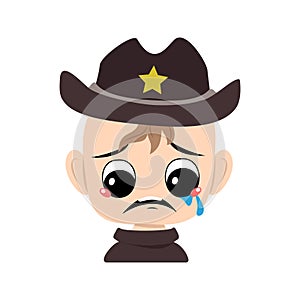 Boy with crying and tears emotion, sad face, depressive eyes in sheriff hat with yellow star