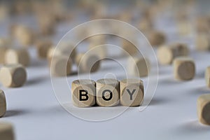 Boy - cube with letters, sign with wooden cubes