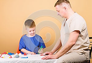 Boy cute child and his father doctor. Hospital worker. First aid. Medical help. Trauma and injurie. Medicine concept photo