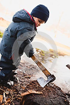 Boy cutting wood