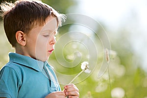 Boy with dandelion