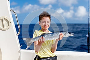 Boy deep sea fishing