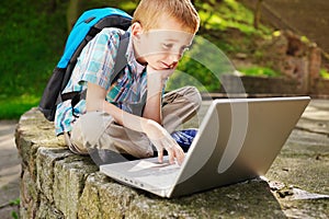 Boy delighted with laptop