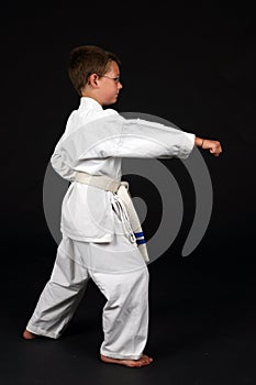 Boy demonstrating right stance in karate