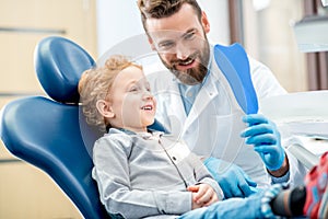 Boy with dentist at the dental office