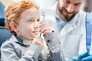 Boy with dentist at the dental office