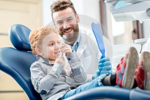 Boy with dentist at the dental office