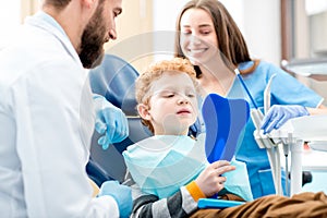 Boy with dentist at the dental office