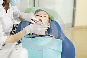 Boy and dentist during a dental procedure