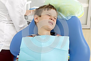 Boy and dentist during a dental procedure