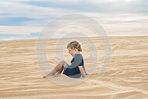 Boy in the desert. Traveling with children concept