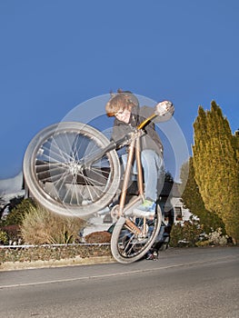 Boy with dirtbike is going airborne