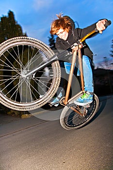 Boy with dirtbike is going airborne photo