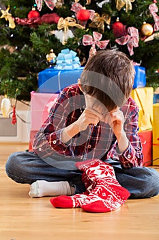 Boy dissatisfied with christmas present