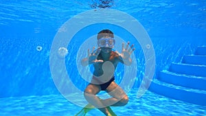 Boy dive in swimming pool