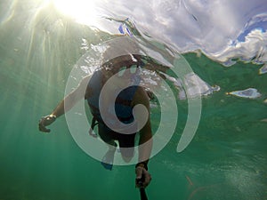 Boy diving snorkeling ocean underwater mask selfie