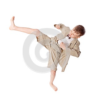Boy does karate kick