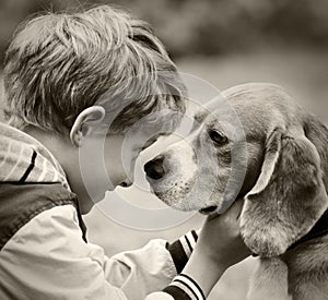 Boy and dog black and white portrait