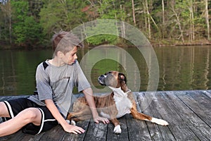 Boy and Dog on Dock looking at each other