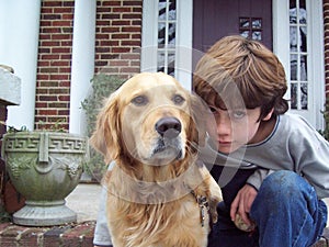 Boy and dog on porch